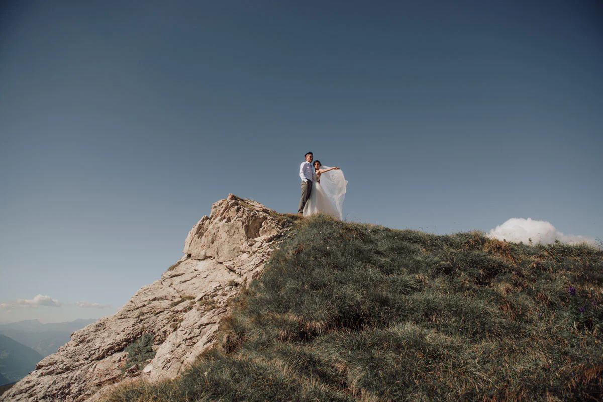 Bride and groom photographed during a mountain wedding in the Dolomites