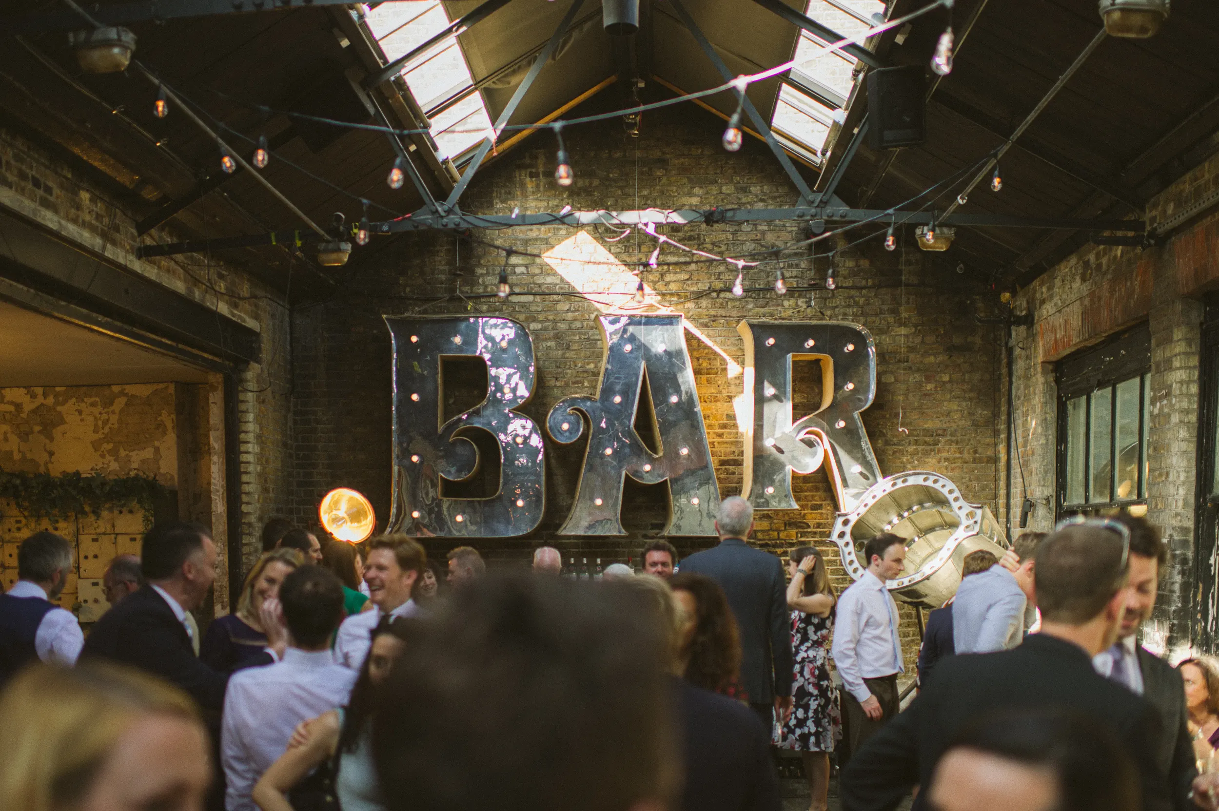 Documentary wedding moment inside MC Motors in Dalston, East London
