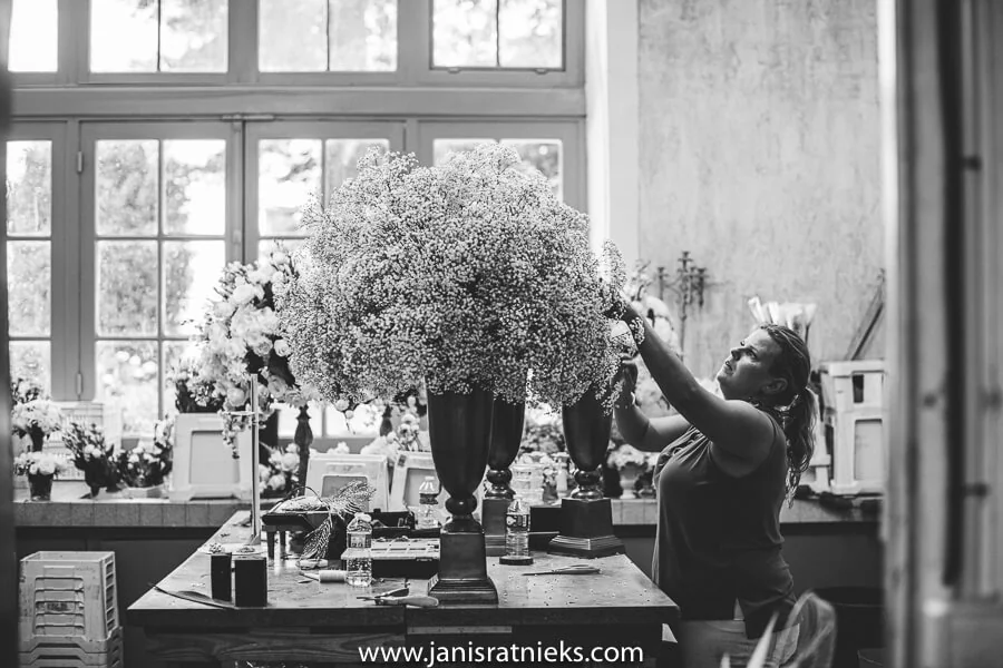 Florist taking care of wedding decorations