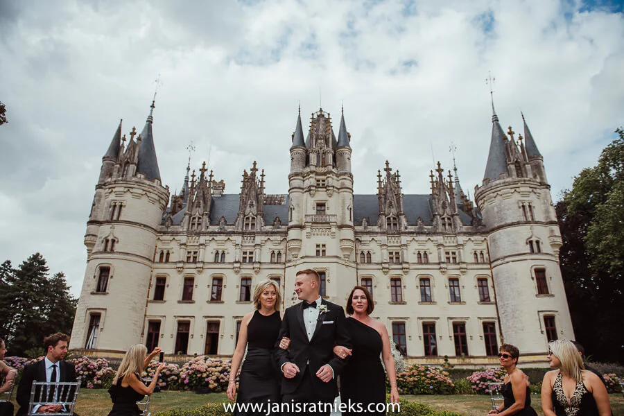 All three very elegant in their black outfits walking down the aisle
