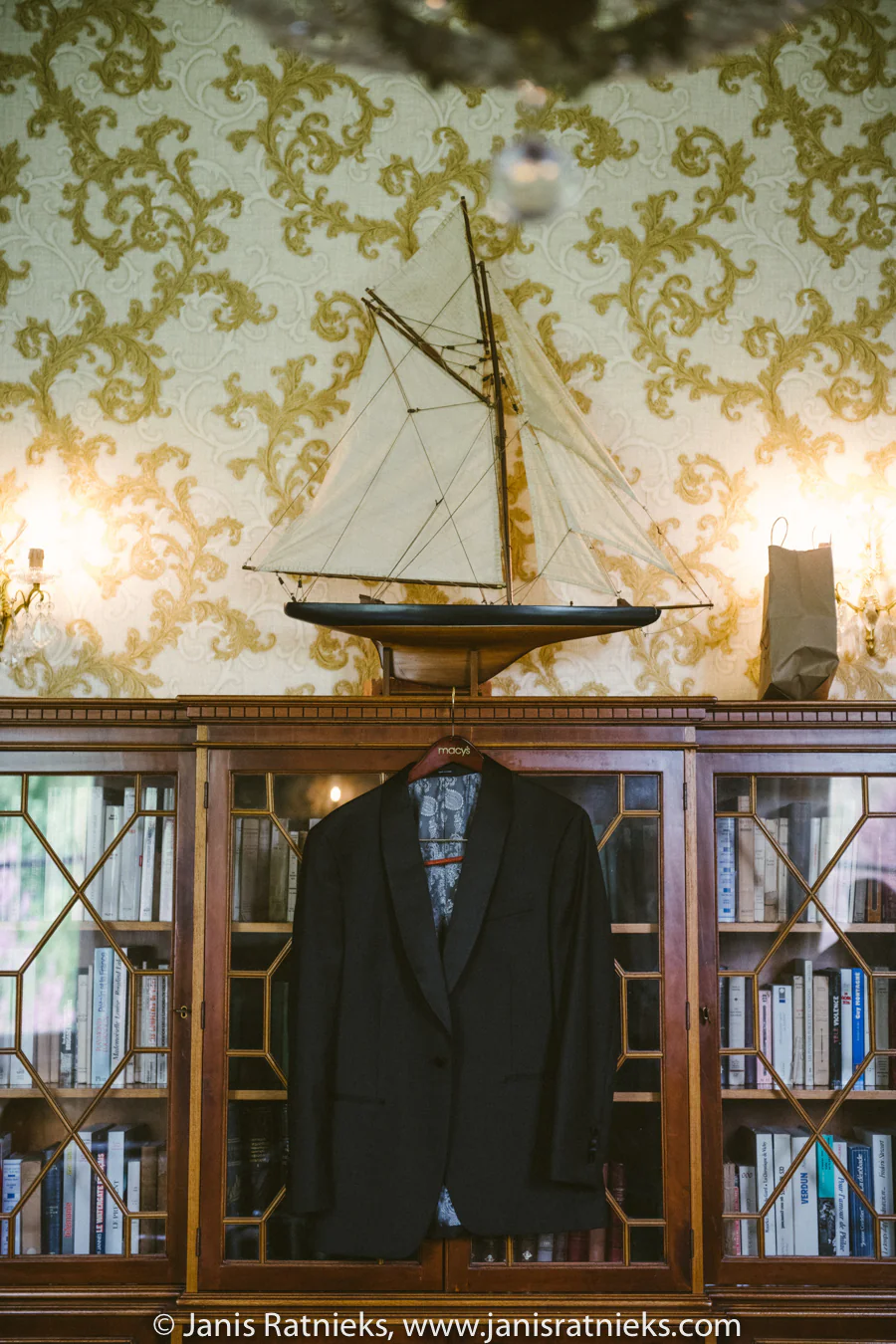 Ramon’s tailored wedding suit hanging at Château de la Borderie