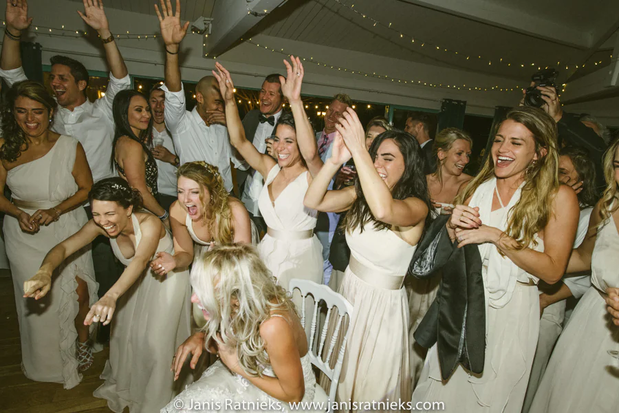 Bridesmaids cheering during the La Hora Loca party