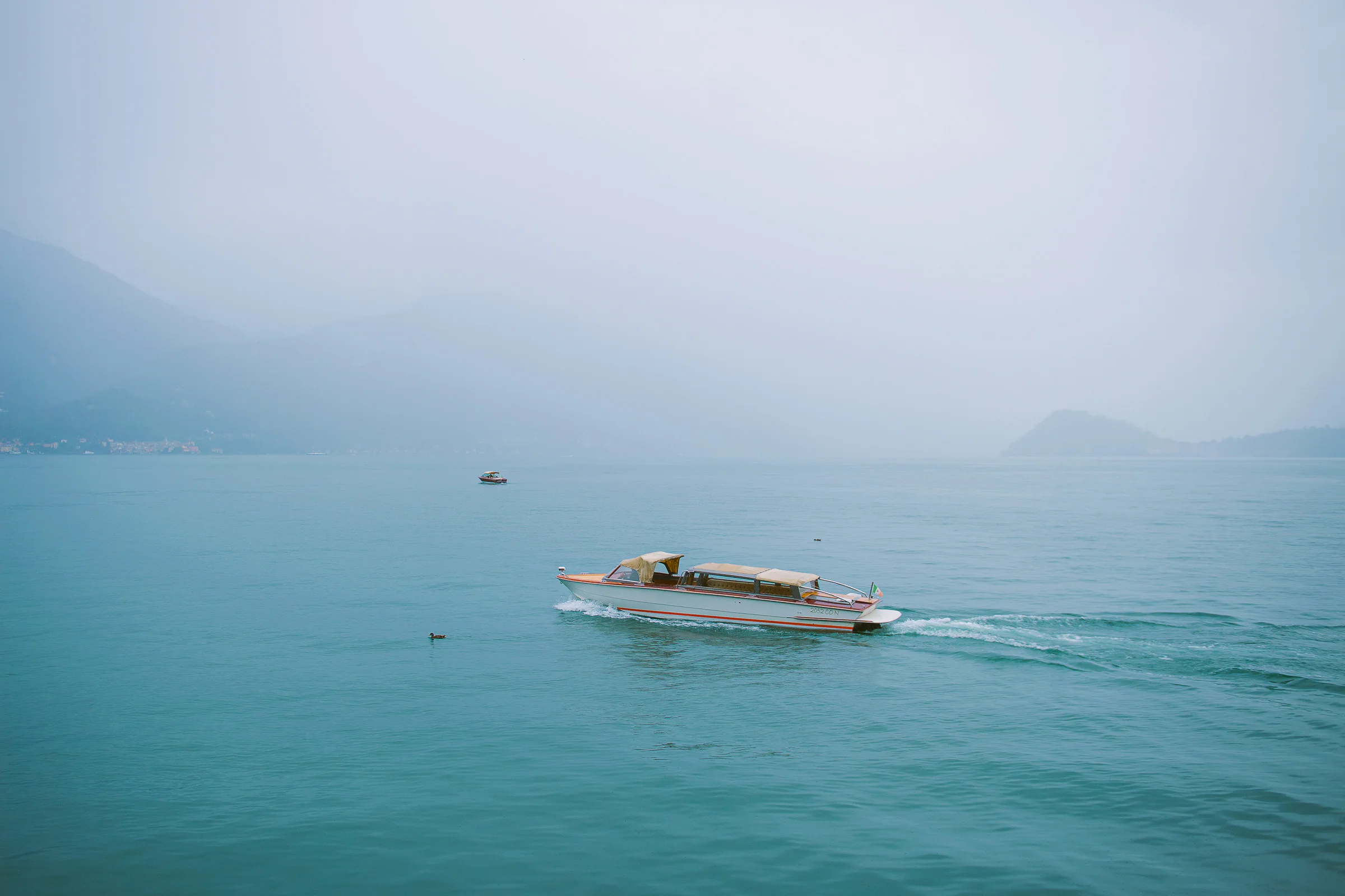 Jane and Lucas on Lake Como during their Riva boat elopement portraits, photograph 39