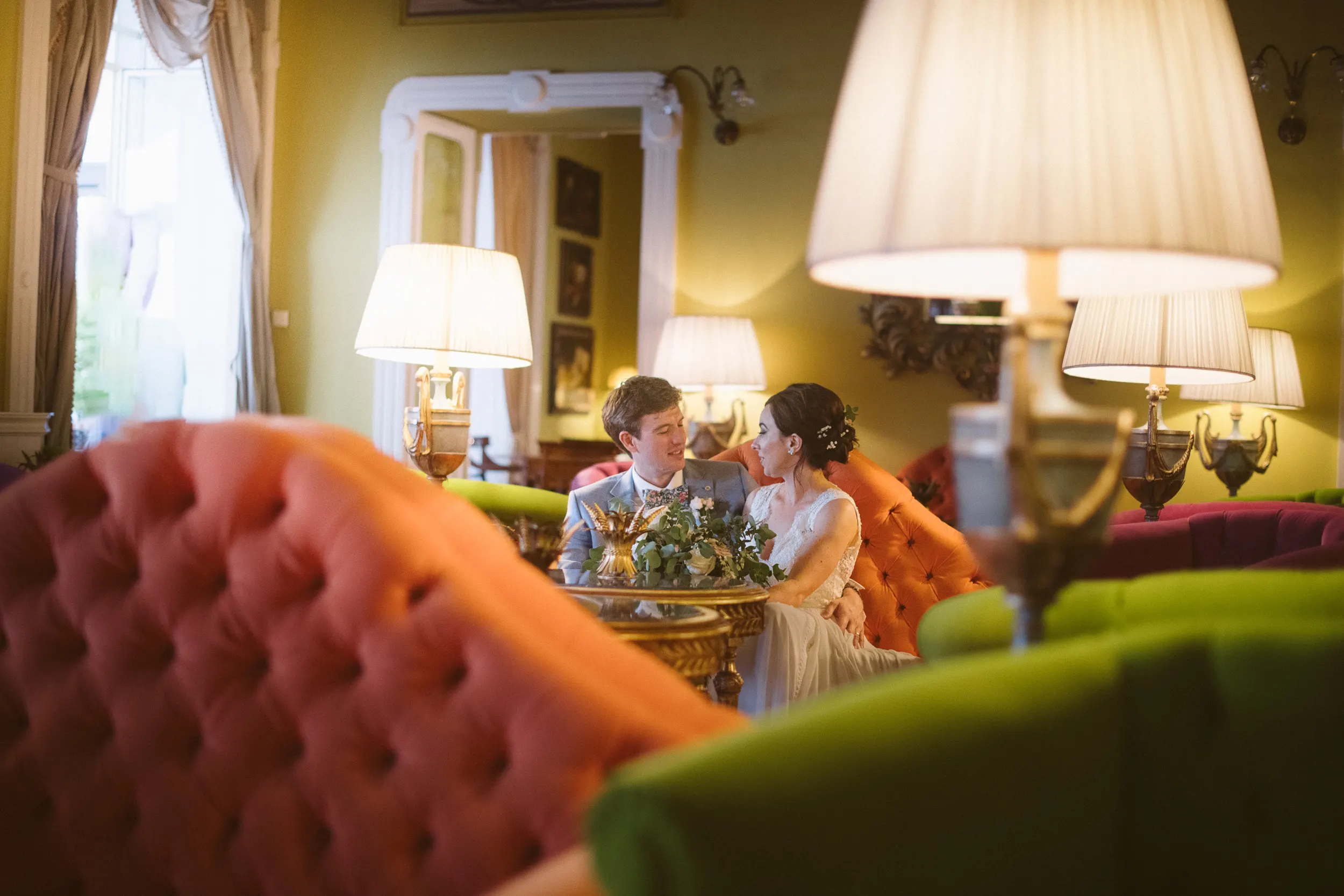 wedding photograph of a bride and groom in the loby var of the hotel Tremezzo during their lake como wedding taken by