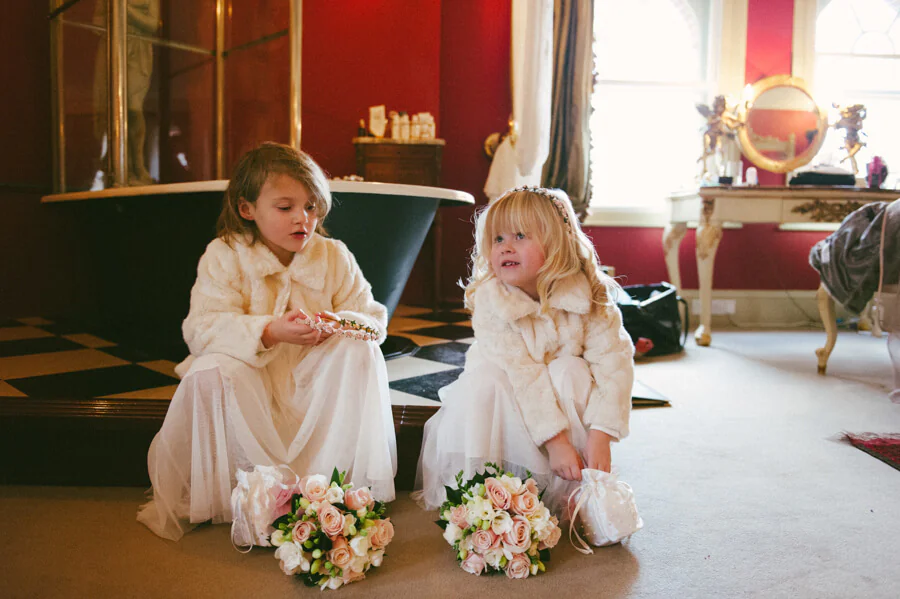 two flower girls dressed in white dresses