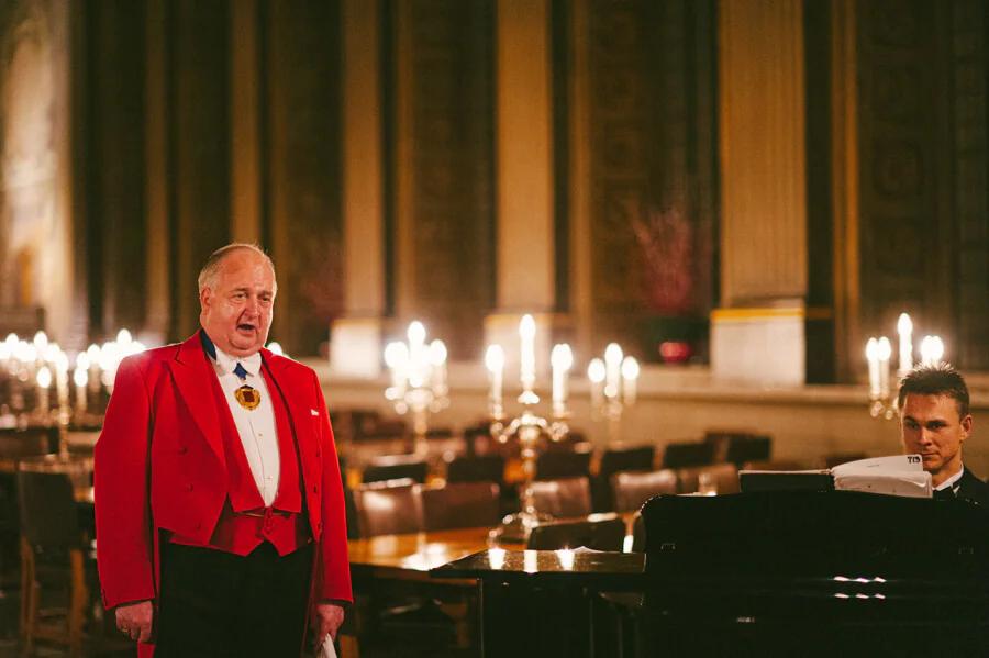 Master of the ceremony singing in red blazer