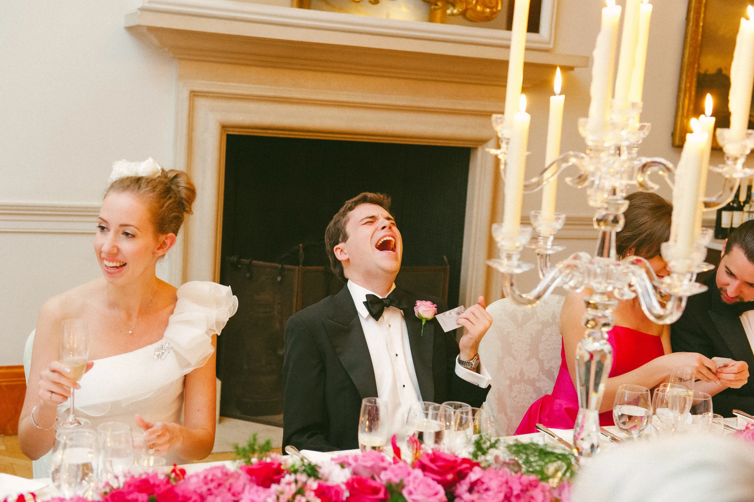 Fiona and Ben seated together at their wedding reception