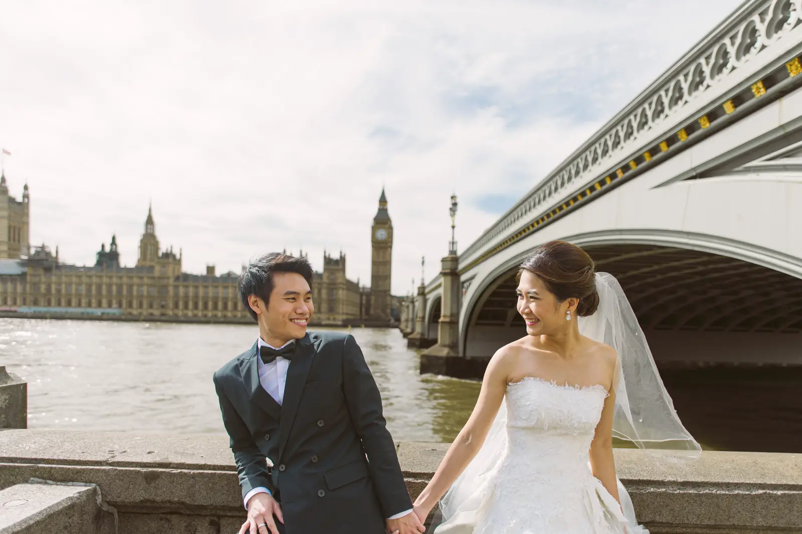 Cinematic London pre-wedding portrait beside the River Thames