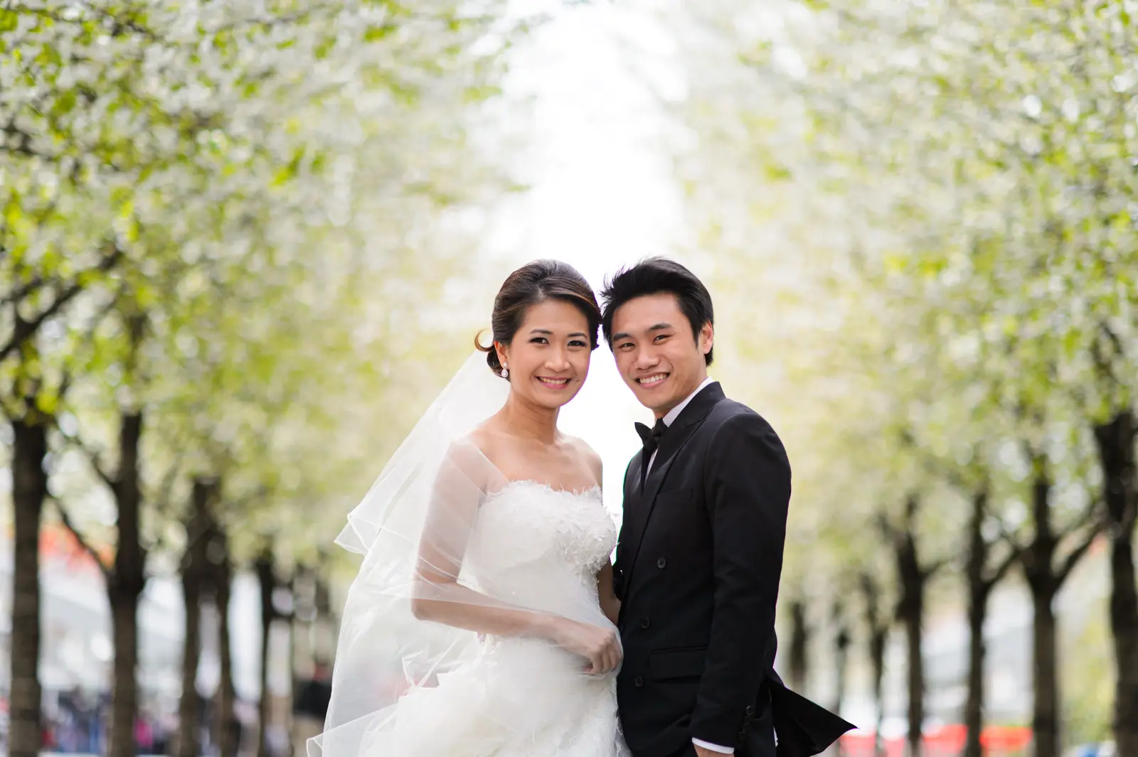 Spring London pre-wedding portrait among fresh green trees
