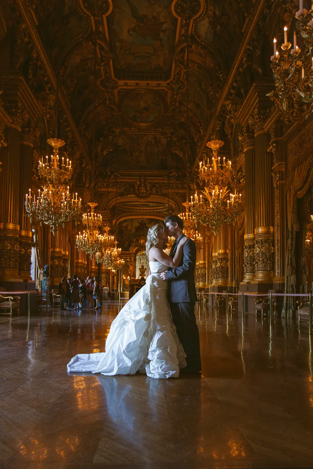 Tabitha and Nathan beneath the gilded interiors of the Paris Opera