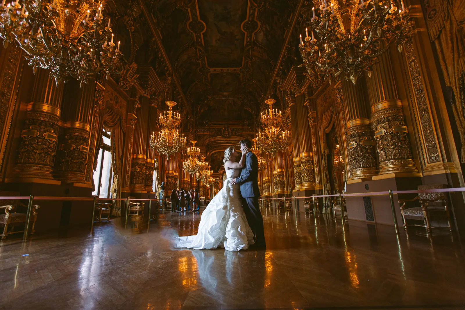 Tabitha and Nathan beneath the gilded interiors of the Paris Opera