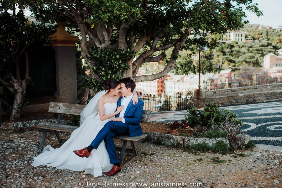 Couple seated beneath a tree on the terrace above Portofino