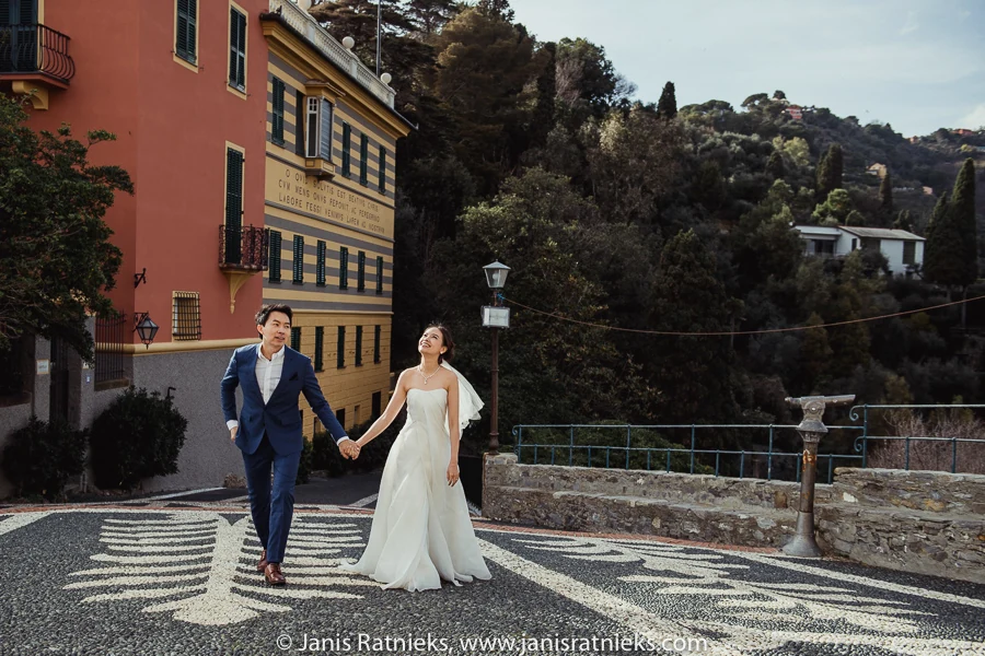 Couple walking across the patterned terrace beside San Giorgio Church