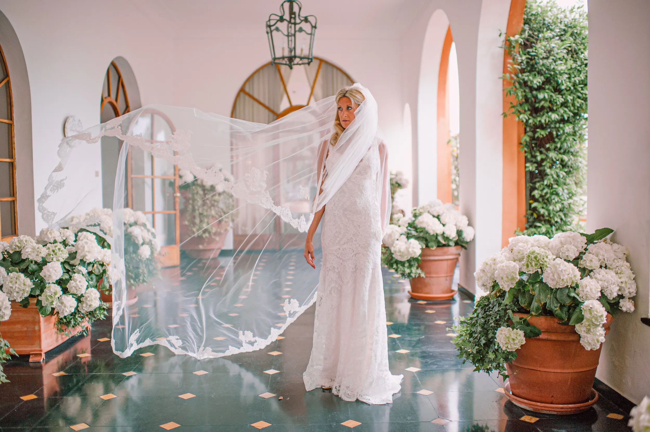 Bride photographed in an arched gallery during a Portofino wedding