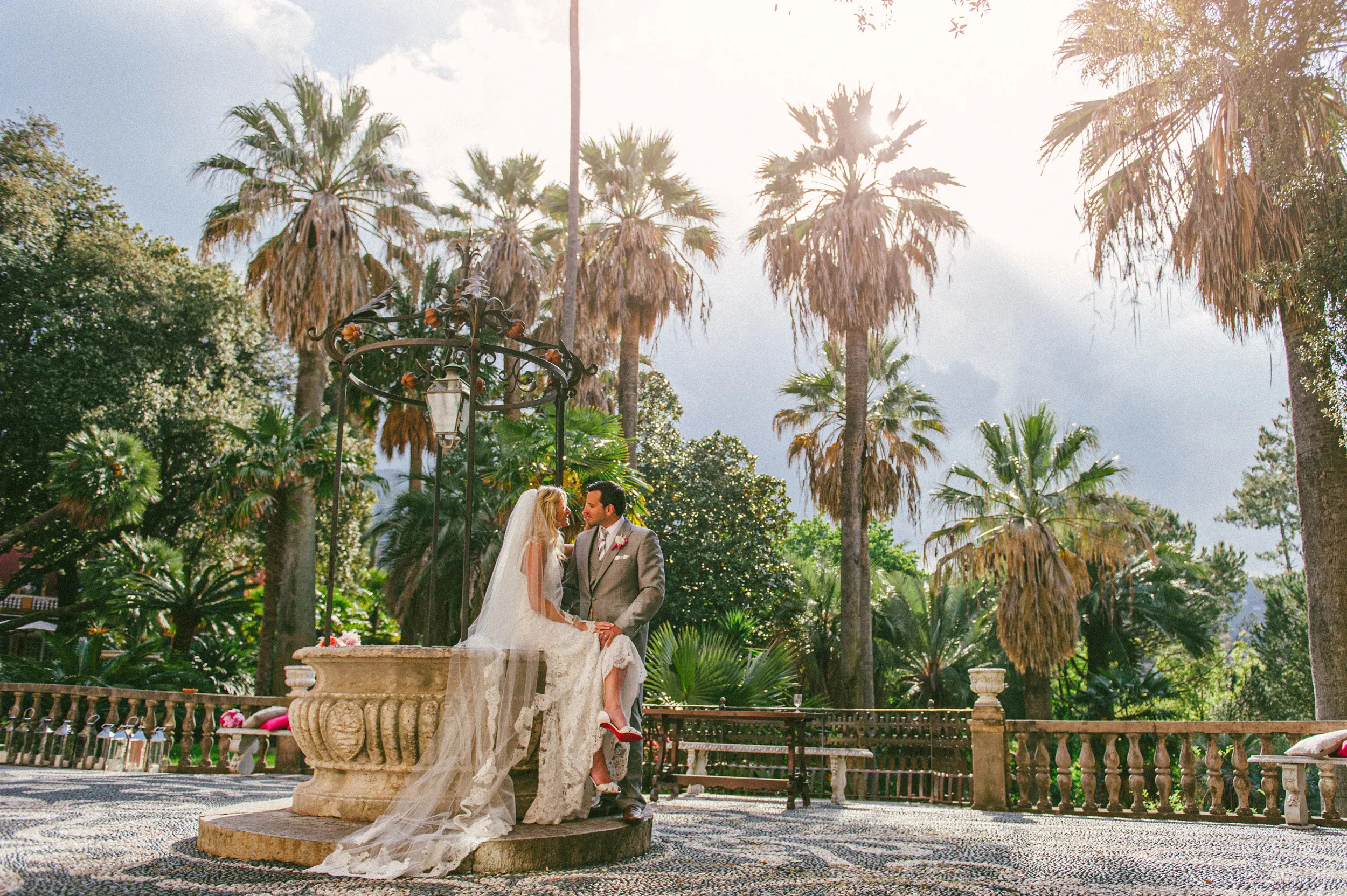 Newlyweds photographed among the palms at Villa Durazzo
