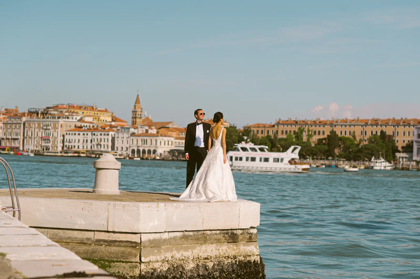 Couple beside a Venice canal during a Europe pre-wedding photoshoot