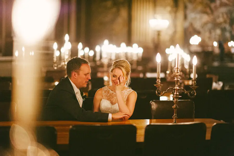 Bride and groom during their candlelit reception at the Old Royal Naval College in Greenwich