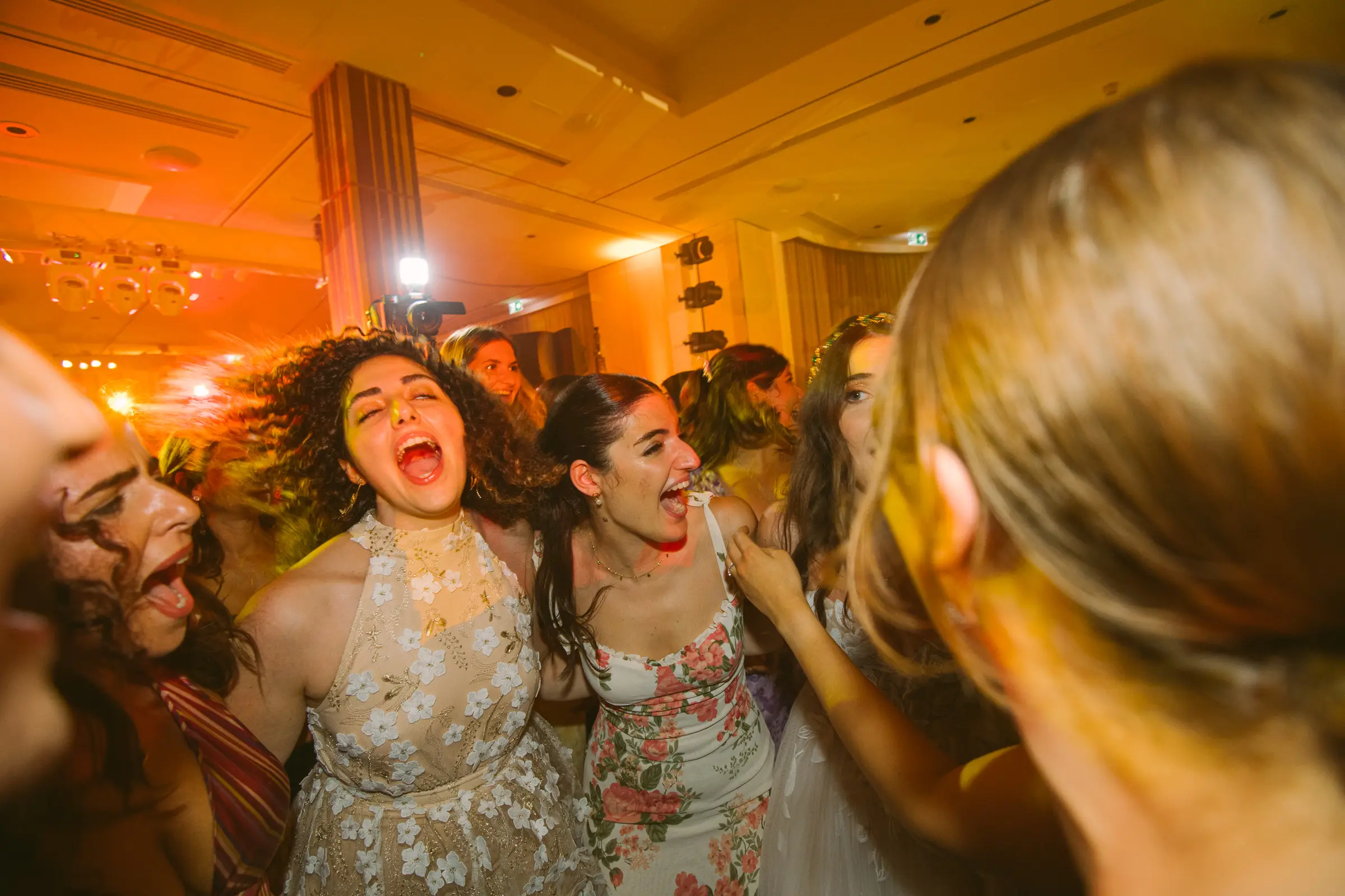 Wedding guests dancing during an evening reception