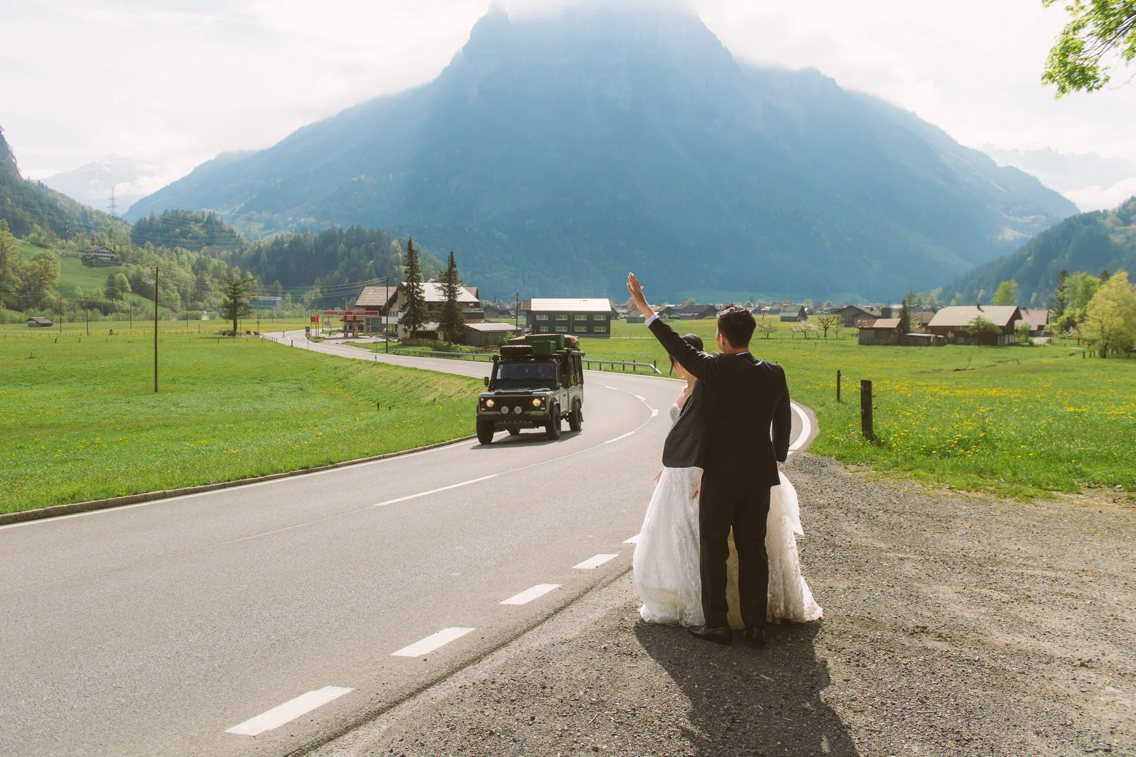 Image 9: Pre-wedding photo of couple in natural light with cinematic wide view of Swiss Alps