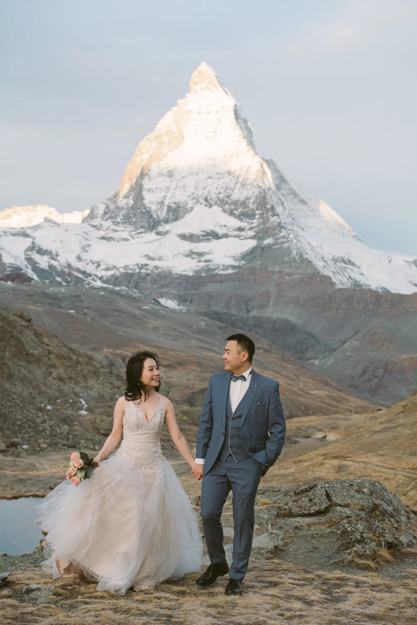 Image 1: Couple posing for a pre-wedding photoshoot in the Swiss Alps at sunset