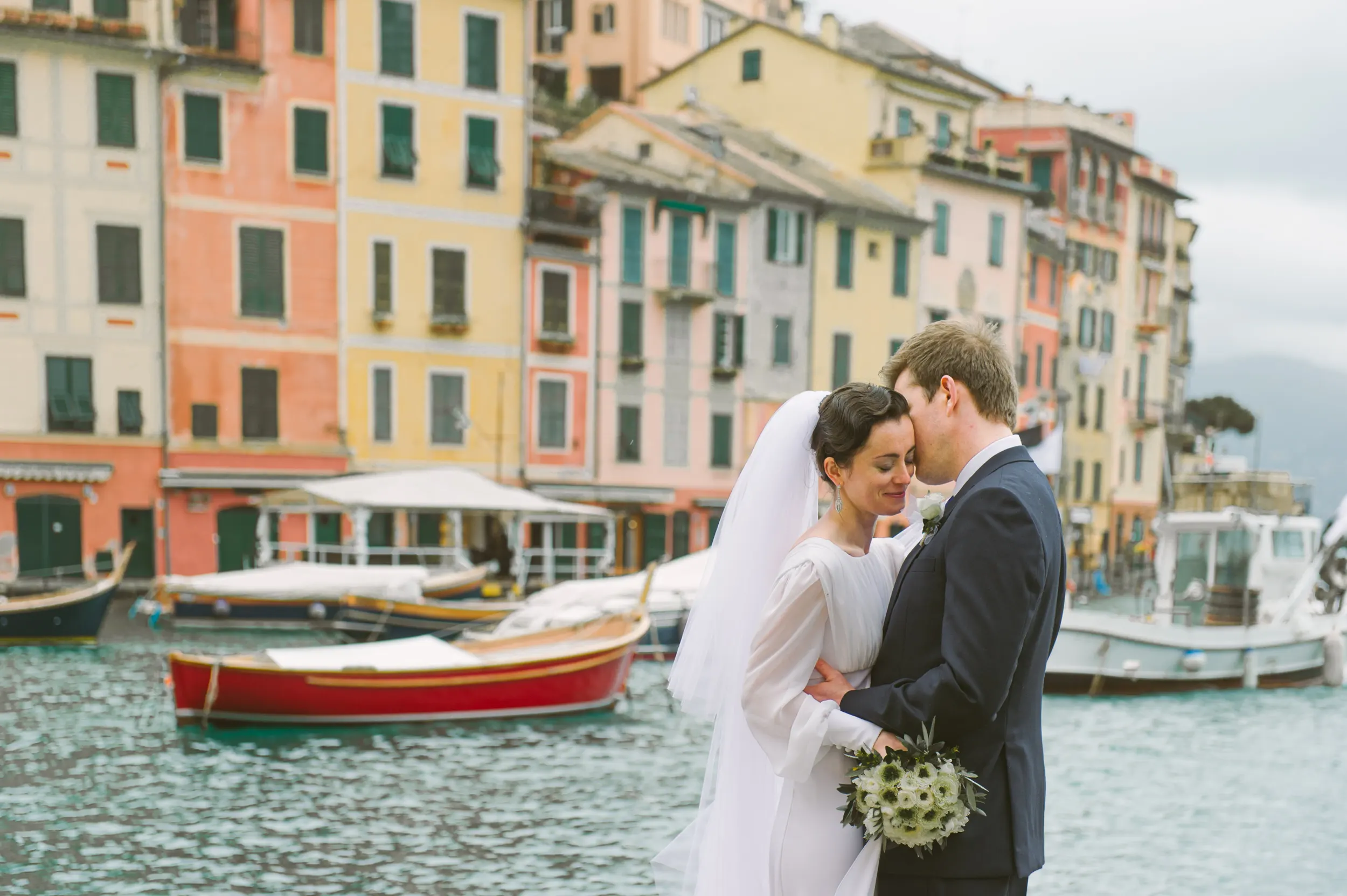 Bride and groom portrait overlooking Portofino harbour on the Italian Riviera
