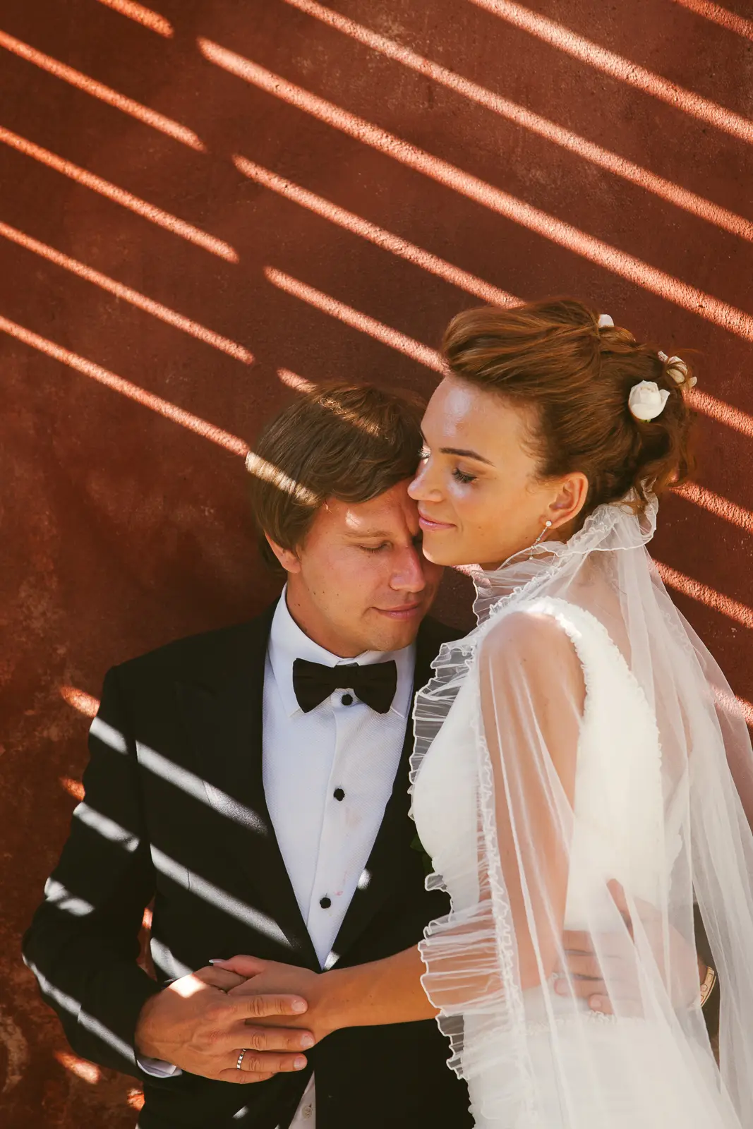 Bride and groom portrait beside Portofino harbour on the Italian Riviera