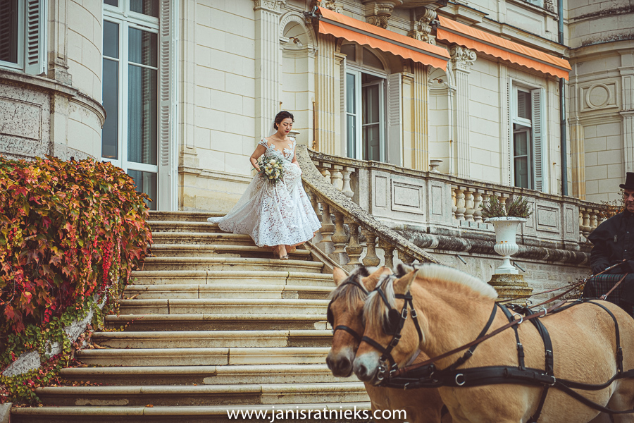 Bride on the stairs of chateau