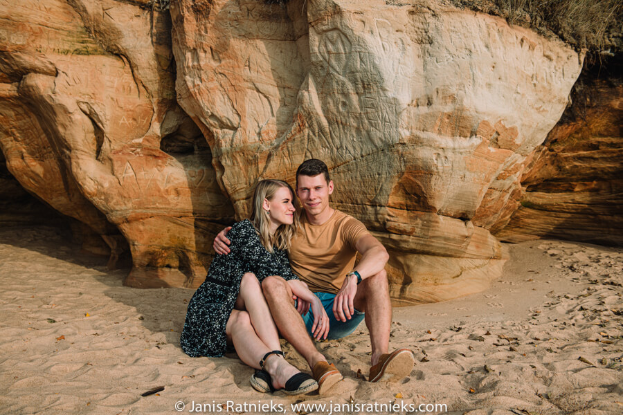 loving couple next to cliffs photos