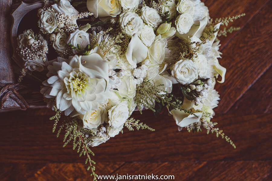 The bride's bouquet was beautifully made from White Dahlias, Roses, Calla lilies, Ranunculus, Lisianthus, and Astilbes.