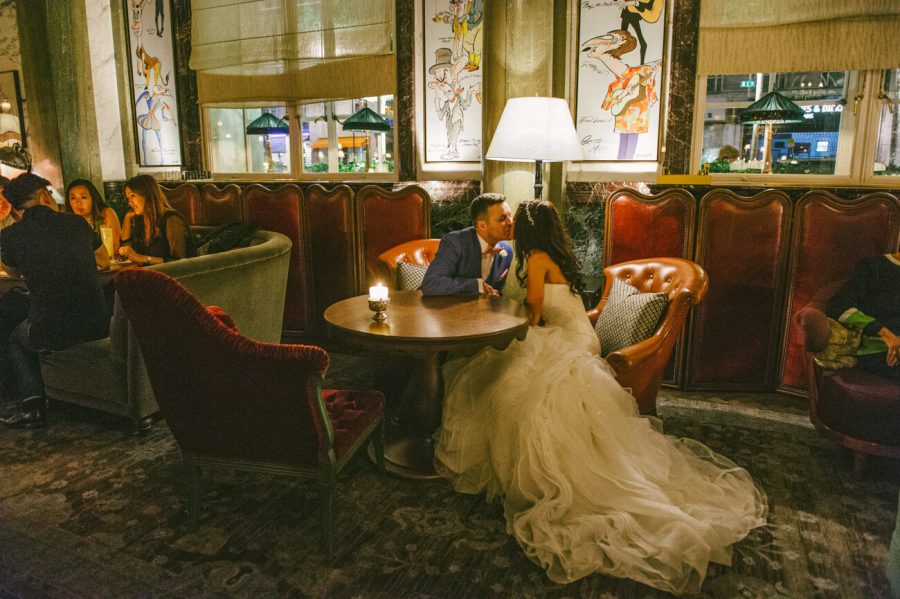 Rosewood wedding in London couple kissing in the lobby bar