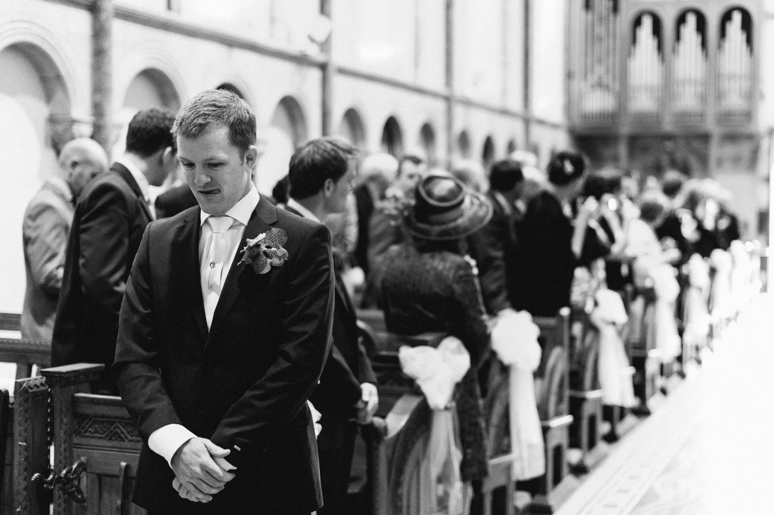 Grooms at the altar, looking more curious than a cat in a room full of laser pointers!