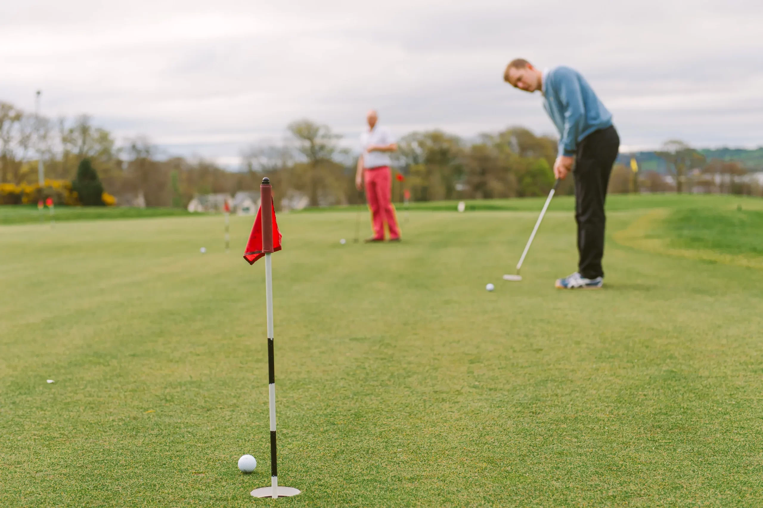 Swing Time with the Gents: Here's the groom and his best men turning the fairways into their own playground. Fore!