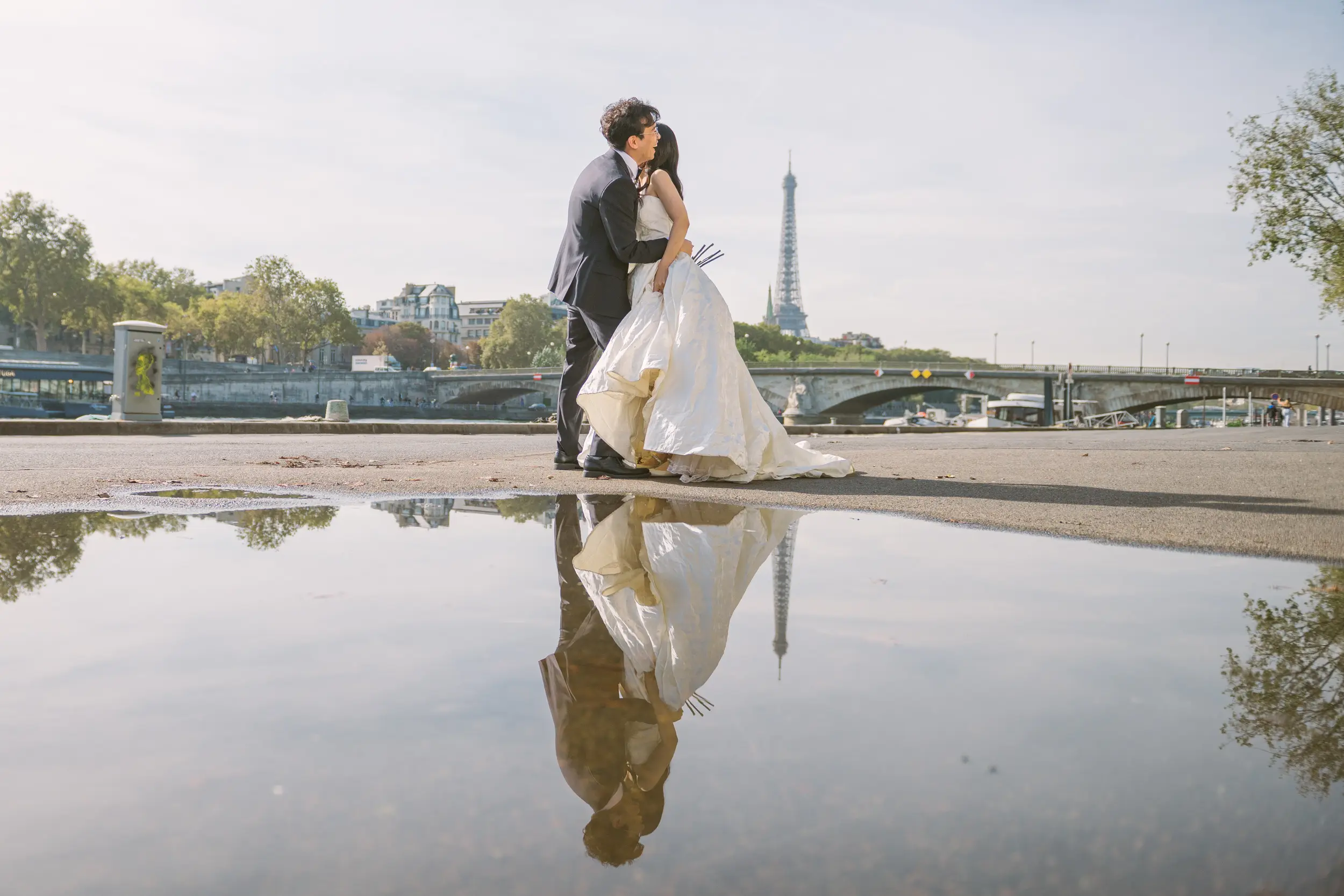 Paris pre-wedding photoshoot, couple hugging each other Eiffel tower in the background