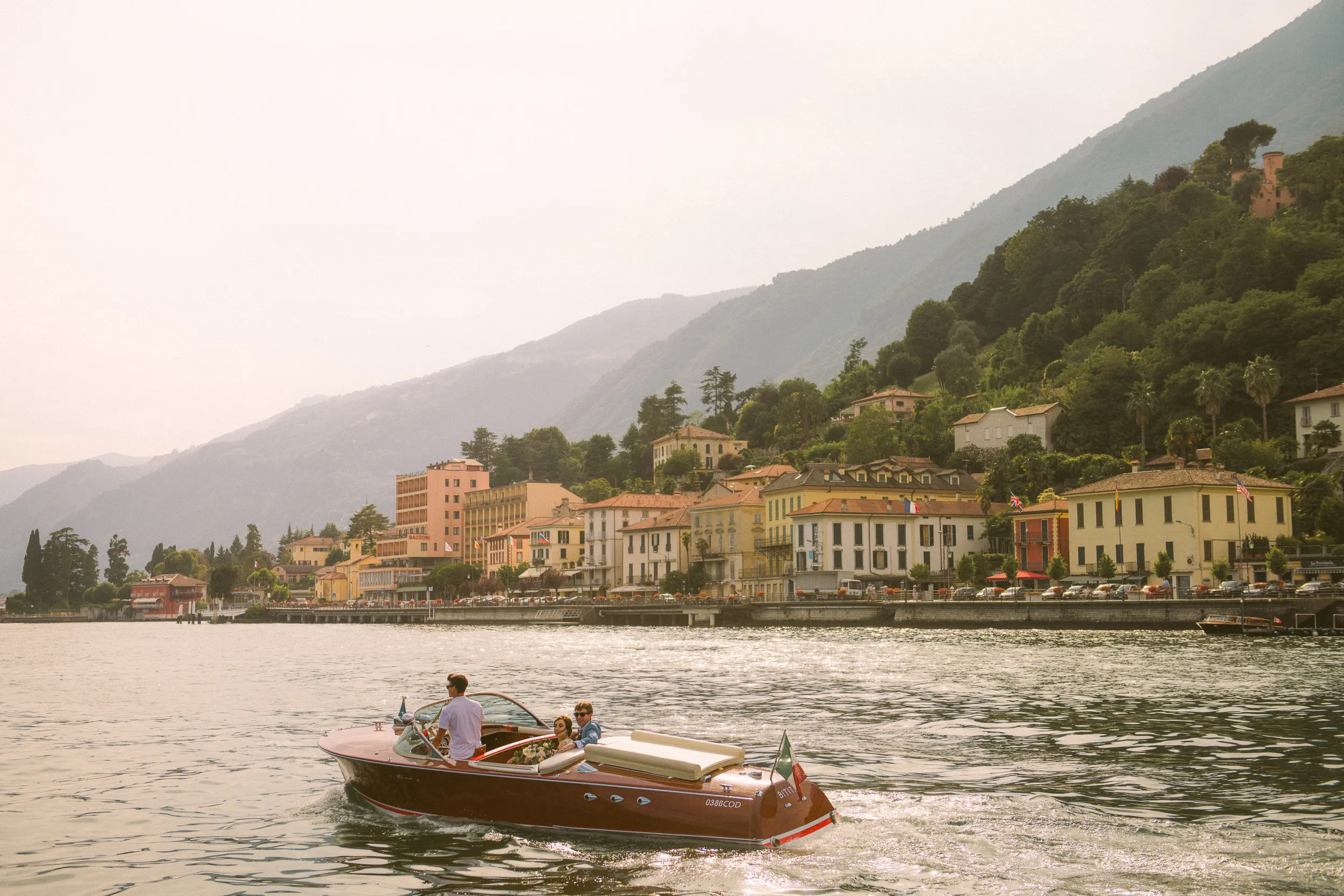como wedding photographer on the riva boat in the middle of lake