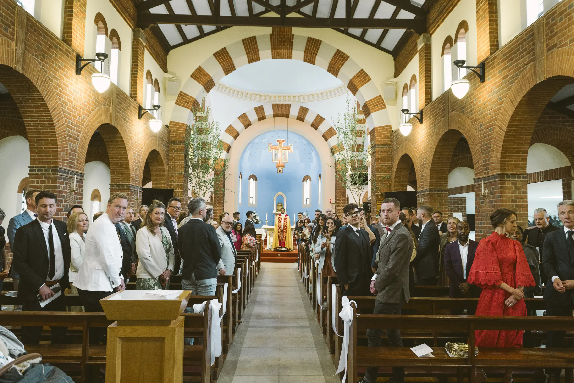 Natalia and Sevan exchanging vows during their wedding ceremony in Berkshire.