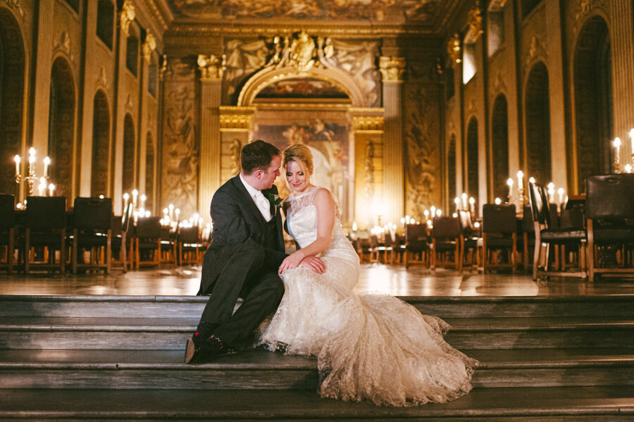 Bride and groom standing beneath the Painted Hall ceiling at the Old Royal Naval College in Greenwich