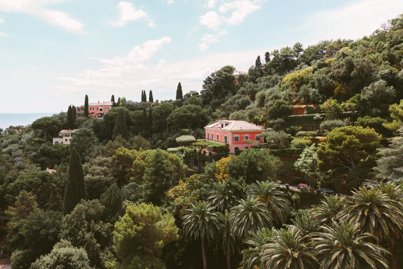 Groom on Hotel Splendido balcony overlooking Portofino harbor