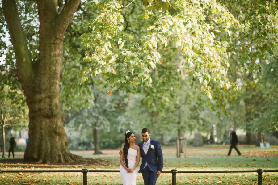 Couple Shree & John among autumn leaves in Regent’s Park London
