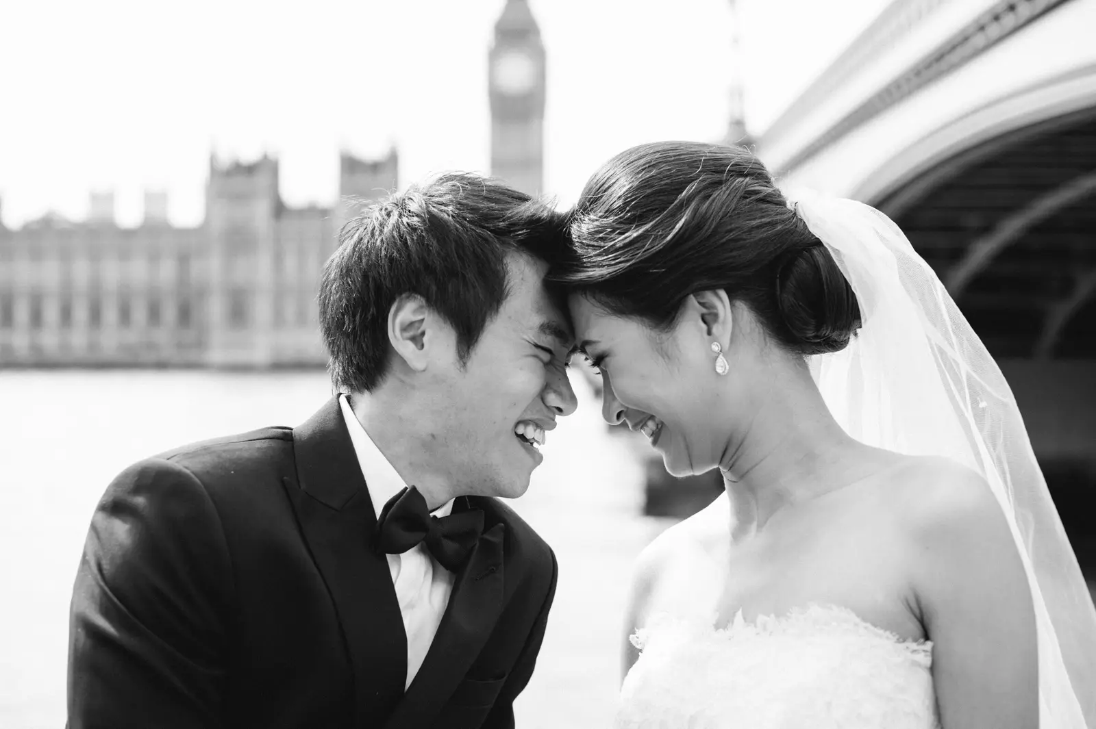 Couple during a London pre-wedding by the Thames with Big Ben in the background