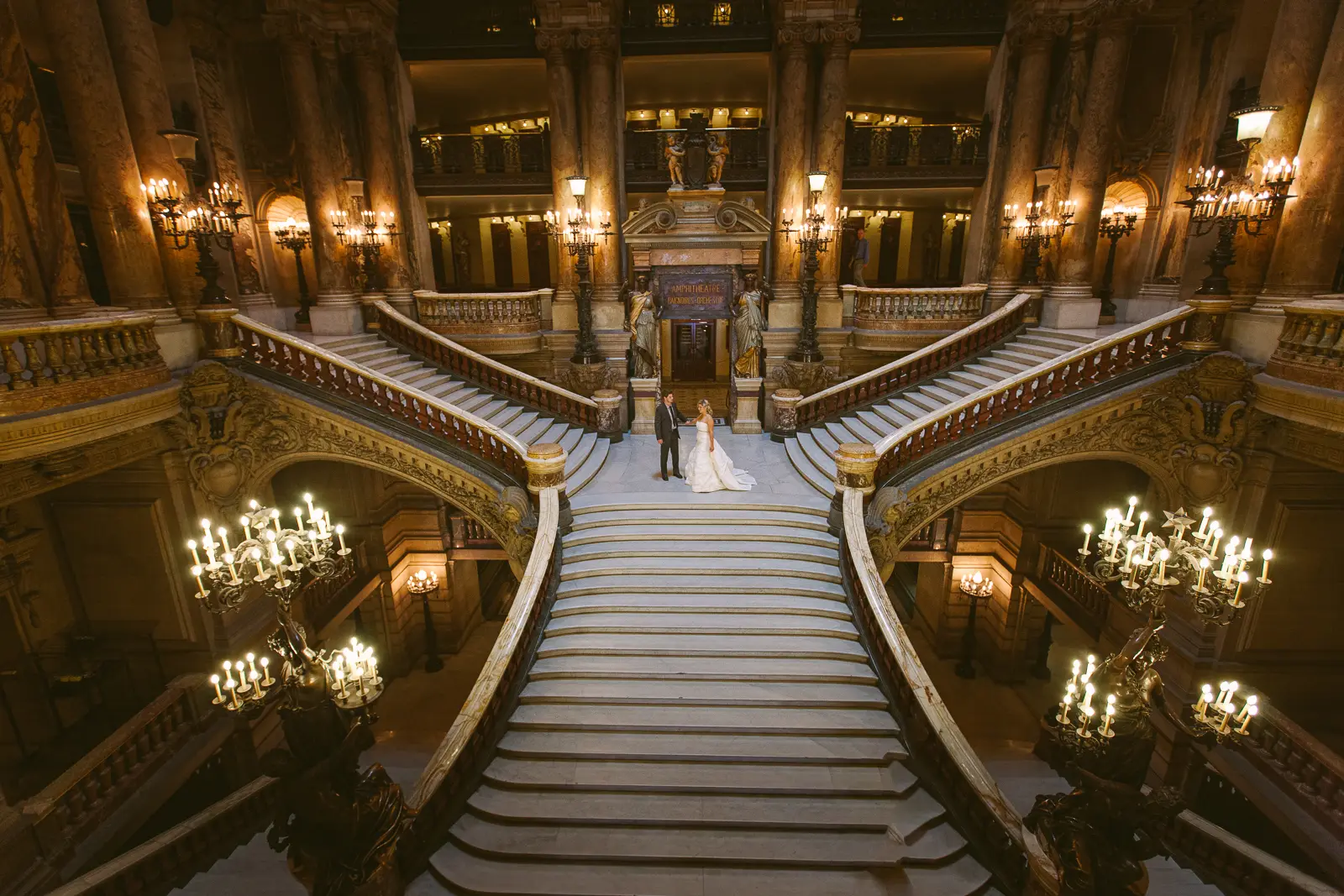 Pre-wedding couple at the Paris Opera in elegant evening wear