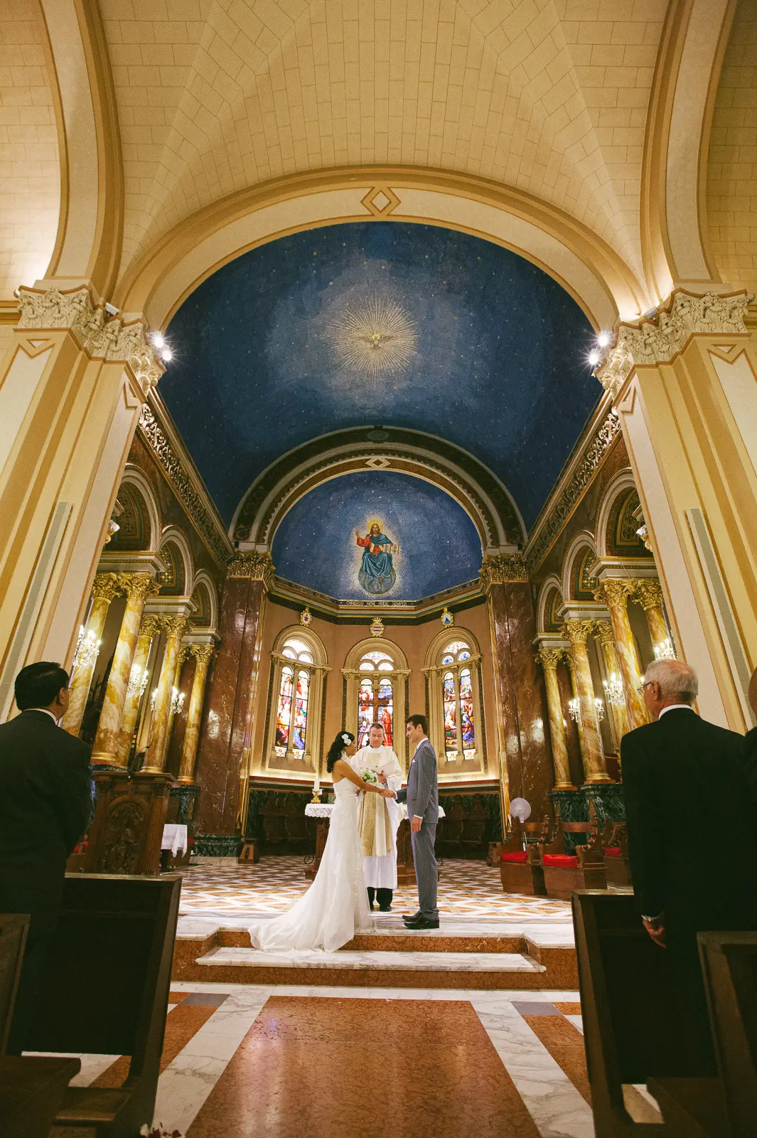Bride and groom walking at Royal Riviera with Mediterranean backdrop