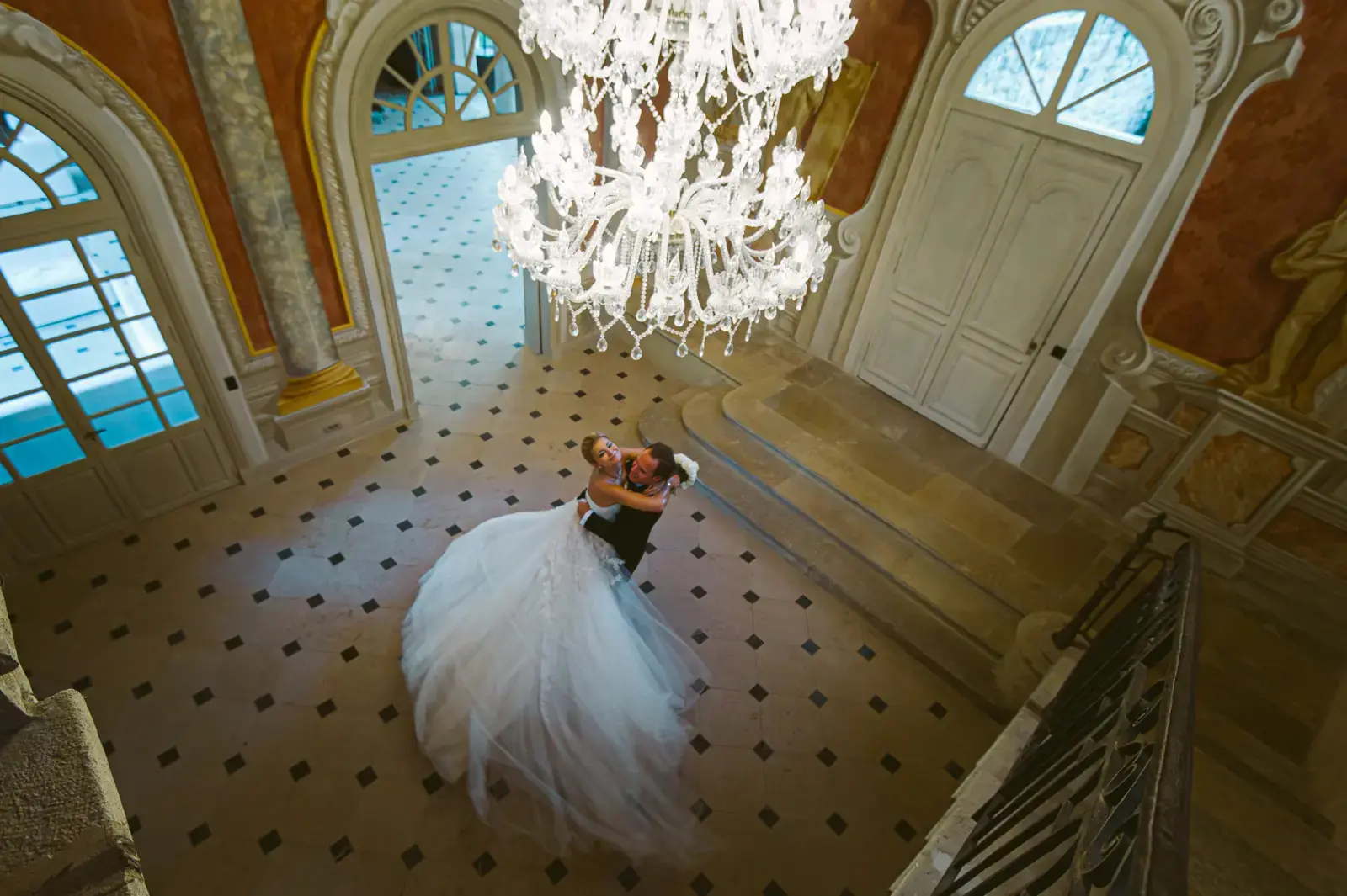 Evening wedding reception at Château Diter lit by candles and string lights