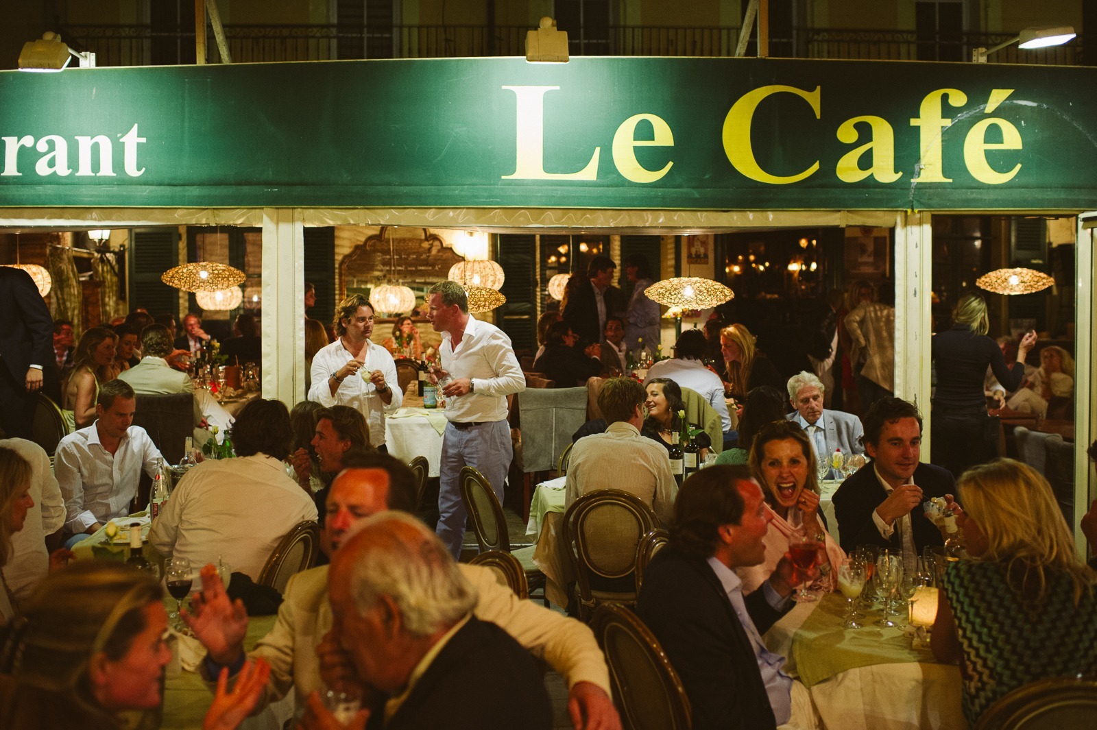 Trees and lights above rehearsal dinner tables in Saint-Tropez