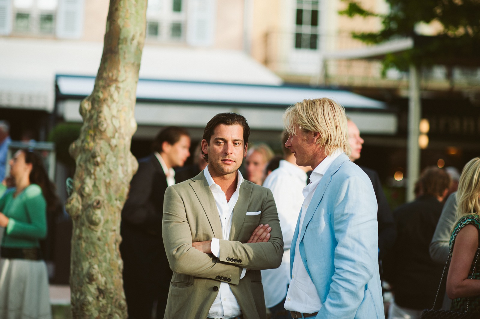 Guests chatting in the shade at Saint-Tropez rehearsal dinner