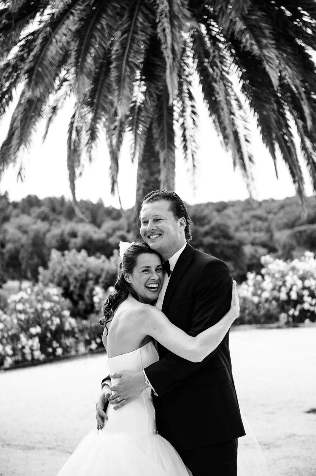 Couple laughing while walking through vineyard near Saint-Tropez