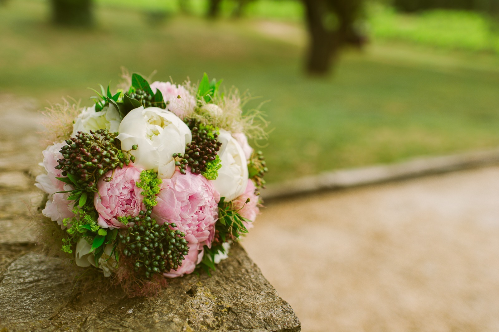 Couple walking out of vineyard path towards lights near Saint-Tropez