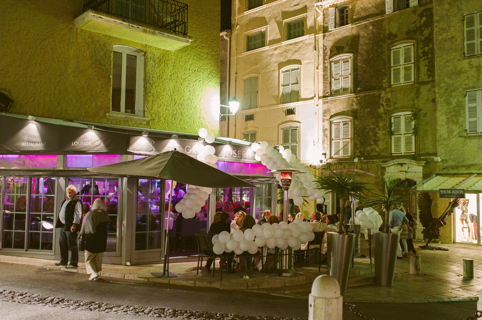Guests talking and eating at Saint-Tropez wedding dinner