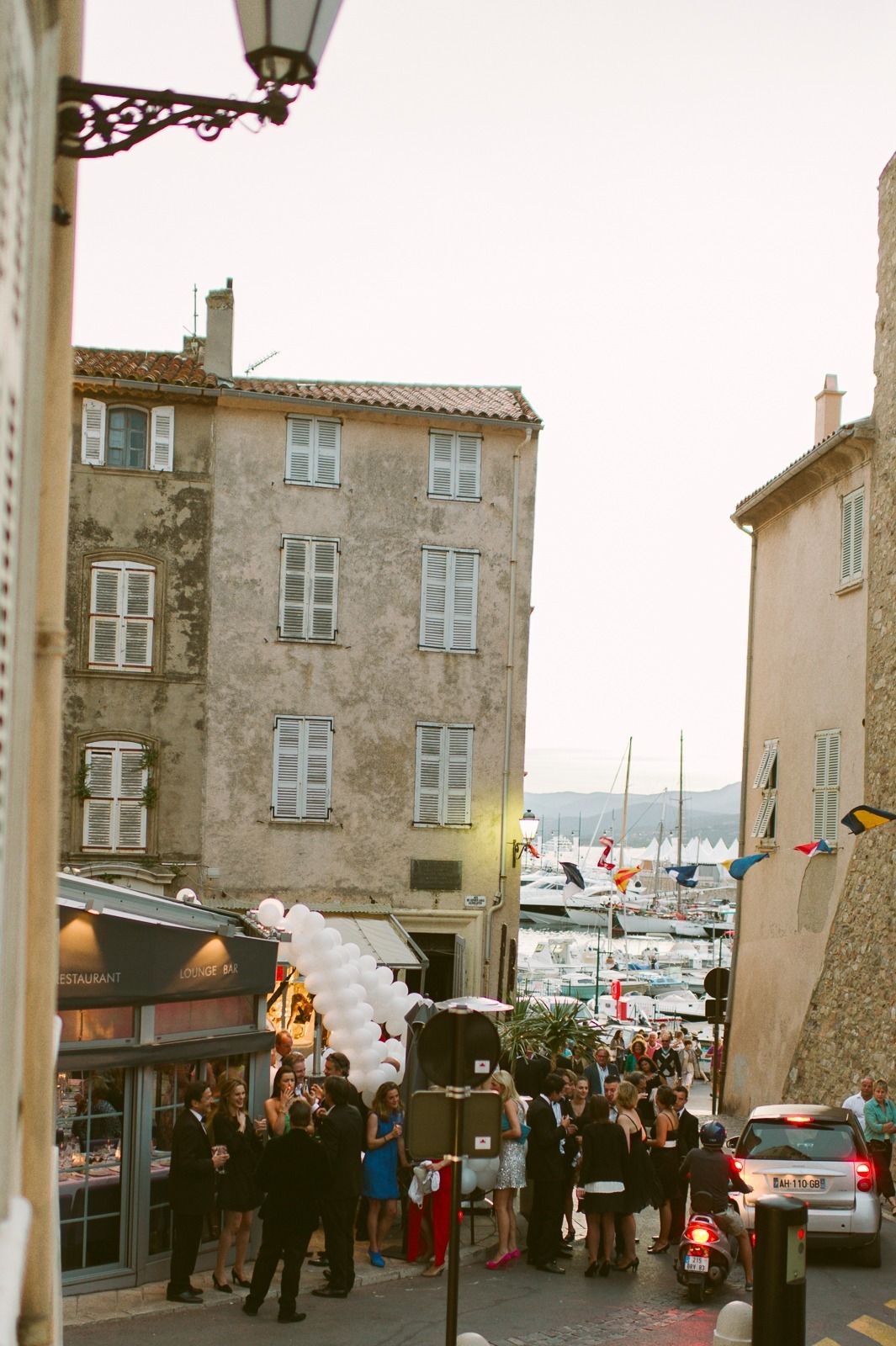 Guests raising glasses for toast at Saint-Tropez wedding reception