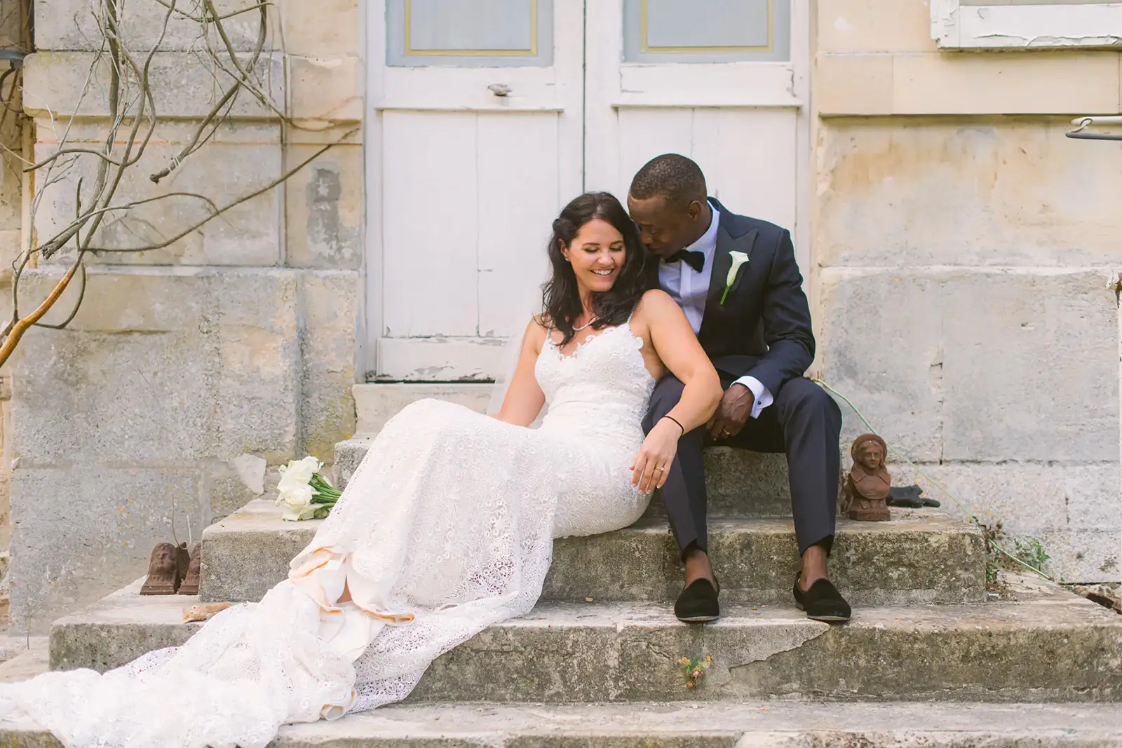 South of France Country wedding bride and groom sitting on the starirs