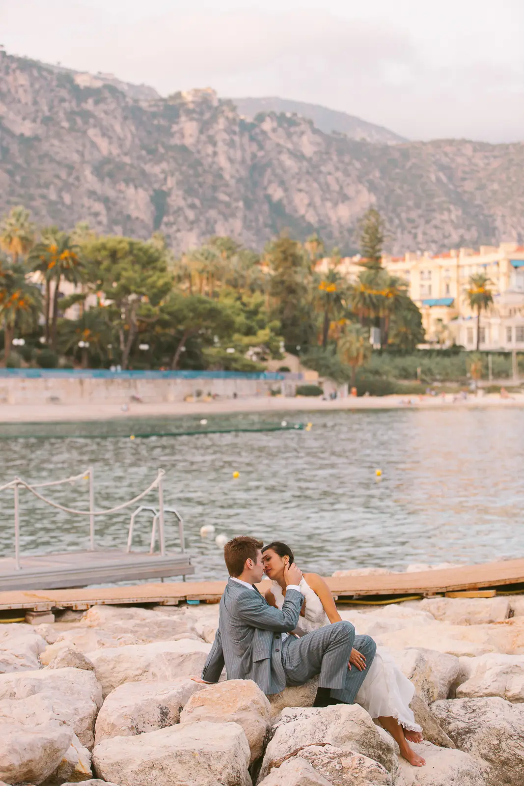 French Riviera pre-wedding couple by the sea in soft evening light